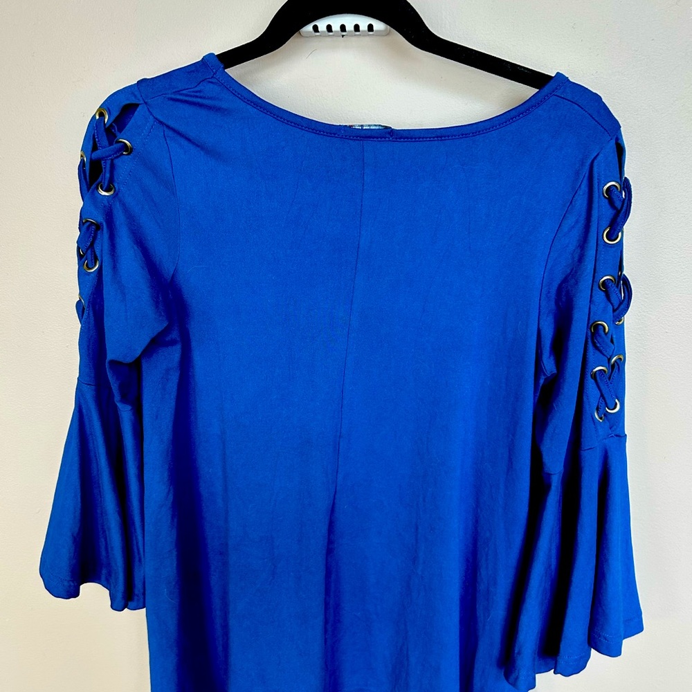 Gorgeous royal blue top with bell sleeves and  beautiful accents on arms size XL